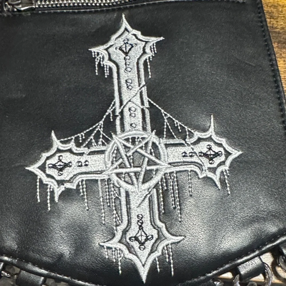 Upside down cross faux leather crossbody bag